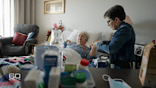 Jan Preuss, with her daughter Brenda Lipsys by her bedside, is a resident at an ARCARE facility in Townsville.