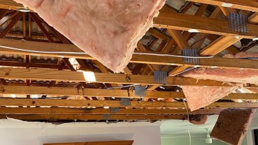 Queensland's storm left roofs and cars damaged, as well as more than 50,000 residents without power. 