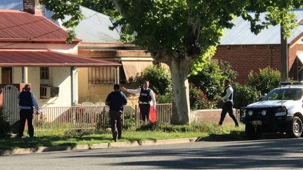 Police search a house in Gurwood Street, Wagga Wagga, where a 19-year-old man was arrested and charged with the murder of Ms Boyd.