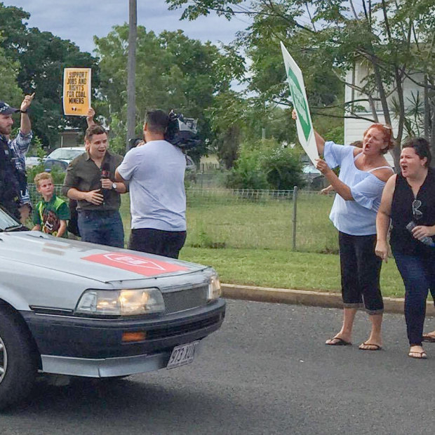 The "Stop Adani" convoy was greeted with disdain when it arrived in the Queensland mining town of Clermont.