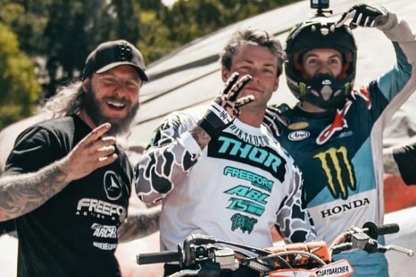 The 27-year-old (pictured centre with fellow motocross racers) was practising the triple backflip that made him famous when he died.