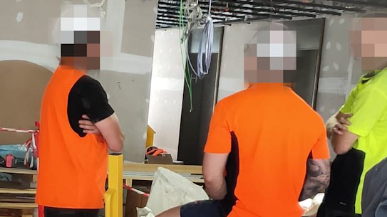 Builders working on Multiplex's Collins Arch projects working in close quarters.