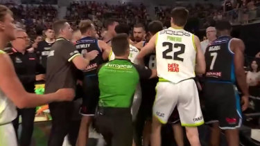United and Phoenix players clash after Creek’s dunk.