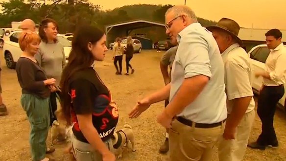 Zoey McDermott refuses to shake the hand of the Prime Minister during his visit to Cobargo.