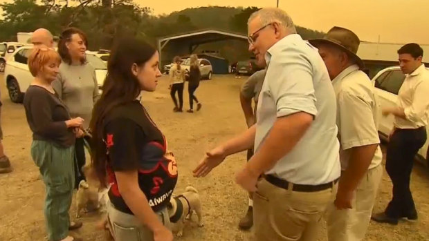 Zoey McDermott refuses to shake the hand of the Prime Minister during his visit to Cobargo.