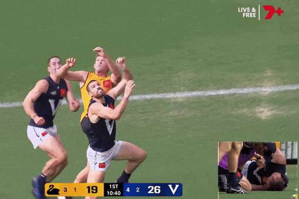 Jacob Weitering is crunched early in the game.