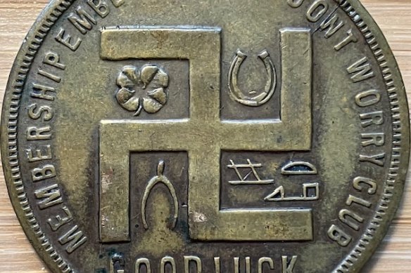 The swastika is seen on a coupon-type store token made before the Nazi Party adopted the symbol.