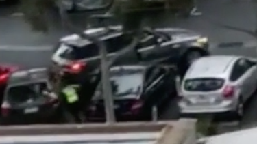 A police officer is thrown from a moving vehicle.