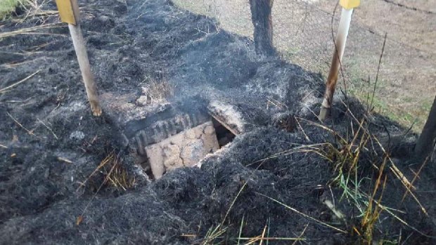 Fire damage at the Telstra cable pit east of Orange.