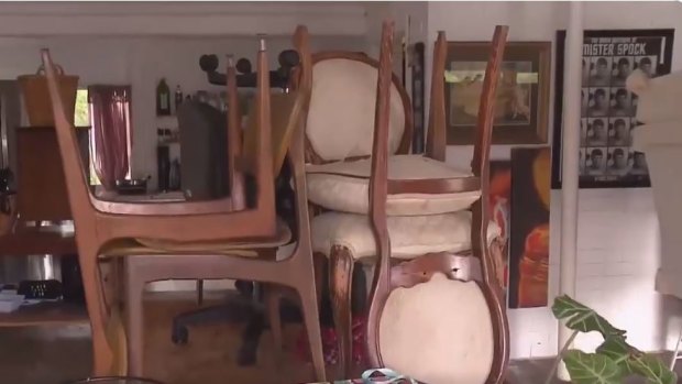 Robby Cenda, who lives on the Tweed River, has tried to save his furniture and belongings from water damage.