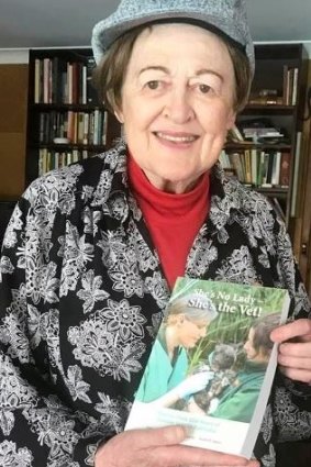 Helen Jones Fairnie with a copy of She's No Lady – She’s the Vet! Stories from 100 years of female vets in Australia.