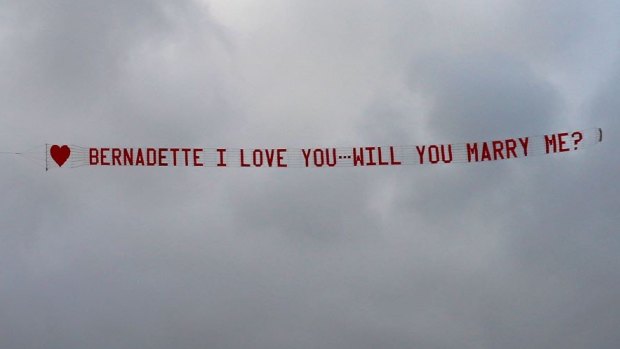 The romantic proposal took to the skies over Perth.
