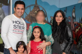 Prabhal (Raj) Sharma and Poonam Sharma with daughters Vanessa (left) and Angela, 10, and an unknown woman. 
