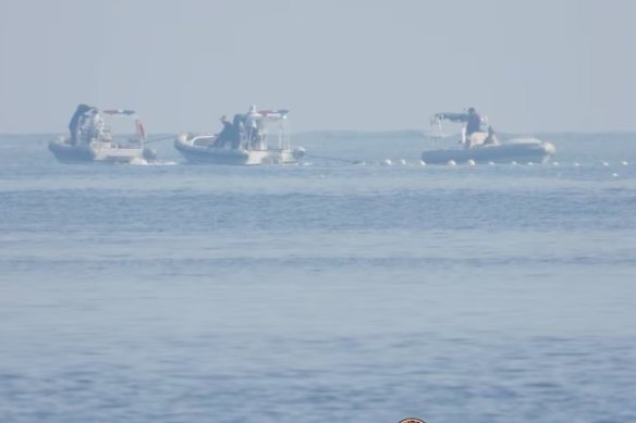 Chinese coast guard ships near the barrier.