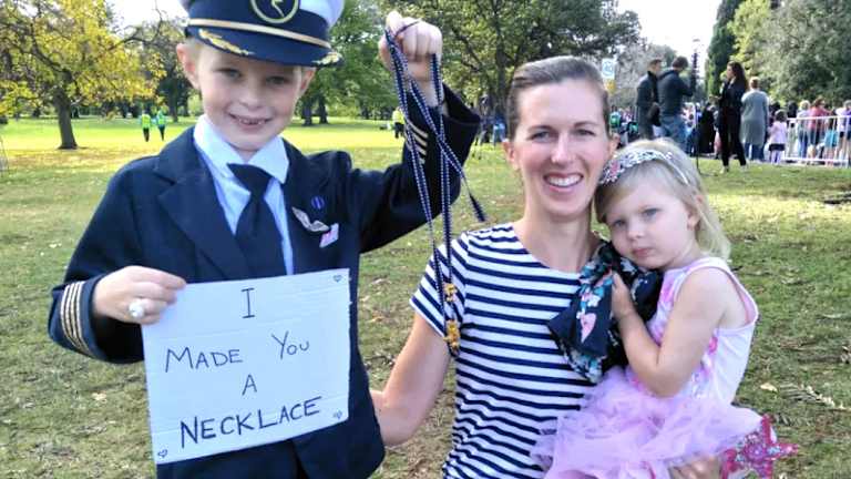Six-year-old Gavin Hazelwood, who made a gold (painted) noodle number for Meghan pictured with his mum and sister before he gave the necklace to the Duchess. 