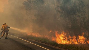 Queensland firefighters are braced for a dangerous collision of weather systems as more than 70 fires continue to burn in the state.