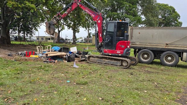Tents being destroyed at an encampment in April after Moreton Bay Council made camping on public land illegal. 