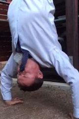 A Facebook image of Andrew Laming MP skolling a beer while doing a handstand back in 2014.