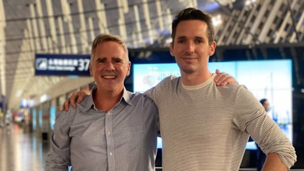 Birtles and Australian Financial Review  reporter Michael Smith leaving China.