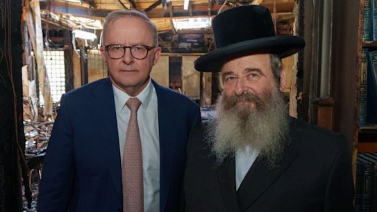 Prime Minister Anthony Albanese with Rabbi Shlomo Kohn inside the blackened shell of the fire-bombed synagogue in Melbourne on Tuesday.