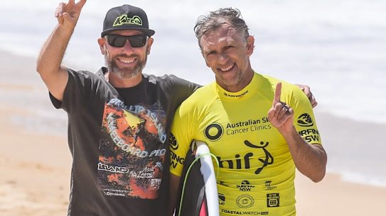 Narrow escape: Urunga surfer Matt Gallagher (right).