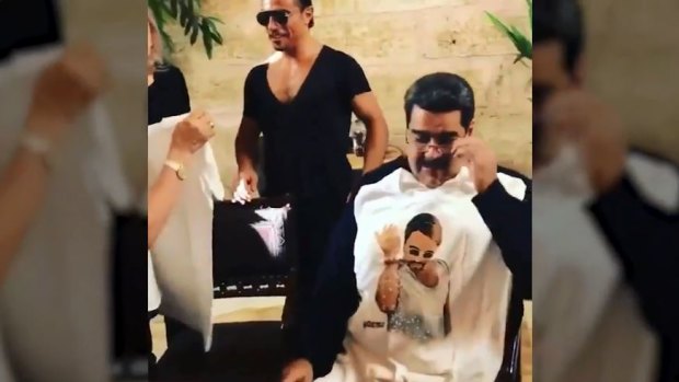 The Miami Herald saved the now-deleted video of Salt Bae (centre) serving Venezuelan President Nicolas Maduro (right).