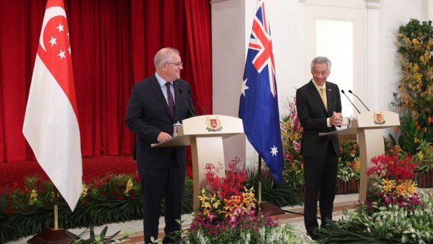 Scott Morrison meets his Singapore counterpart Lee Hsien Loong at a stopover on the way to the G7 in Britain.