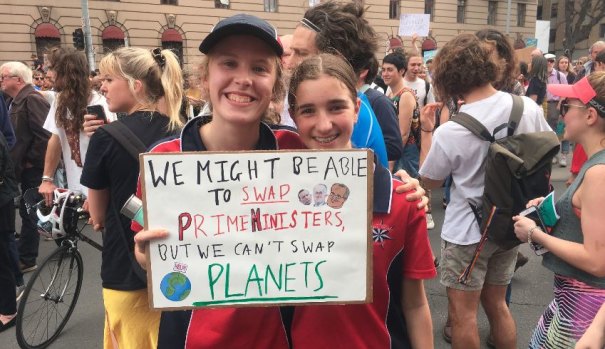 "We might be able to change PMs, but we can't change planets." Zoe and Gemma, 13, at Friday's rally.