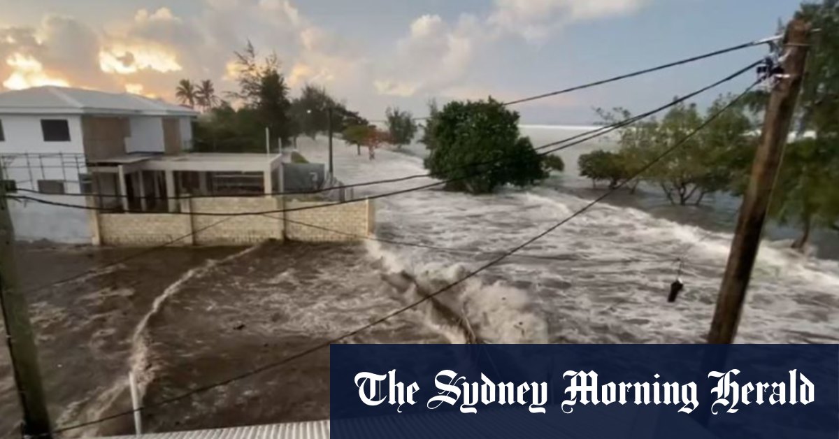 Waves crash into Tonga homes as tsunami warnings sound across the Pacific