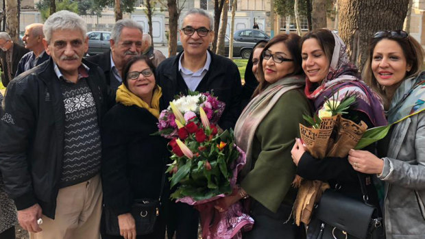 Afif Naeimi, centre, and his loved ones in Tehran shortly after his release.