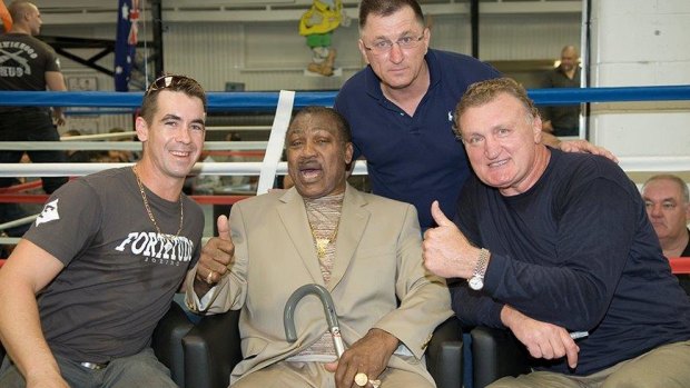 Fortitude Boxing owner Stephen Deller (second from right) with Smokin' Joe Frazier (second from left) and former heavyweight Joe Bugner (right).