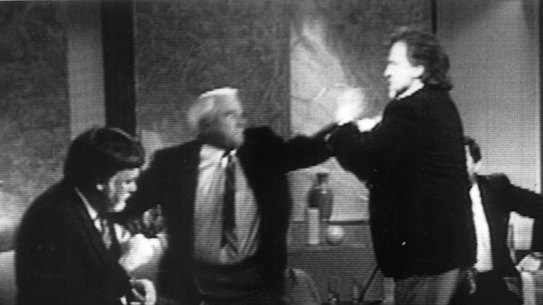 During a discussion on Ray Martin’s Midday Show in 1991, sport reporter Ron Casey disparaged singer Normie Rowe. After Rowe shoved Casey into his chair, Casey threw a punch.