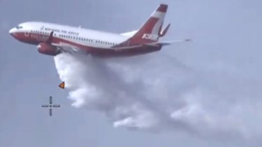 The NSW Rural Fire Service large air tanker is also flying across the border to attack the flames from above.