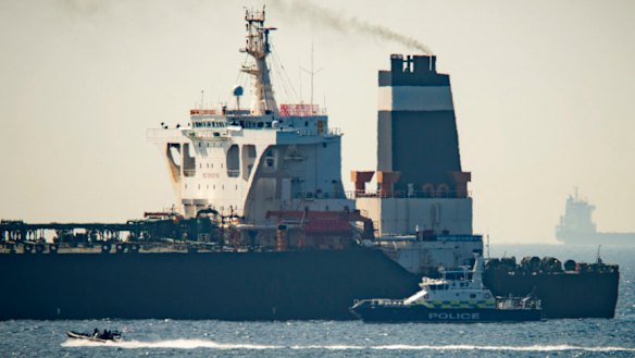 A Royal Marine patrol vessel is seen beside the Grace 1 super tanker in the British territory of Gibraltar. 