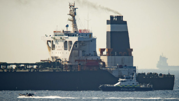 A Royal Marine patrol vessel is seen beside the Grace 1 super tanker in the British territory of Gibraltar. 