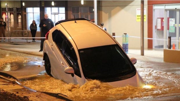 Car plunges into huge sinkhole in Perth's northeast