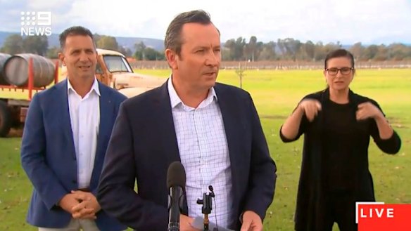 Mark McGowan, accompanied by Tourism Minister Paul Papalia, addresses reporters in the Swan Valley on Monday.
