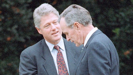 George H. W. Bush shakes hands with president-elect Bill Clinton after an Oval Office meeting 1992. 