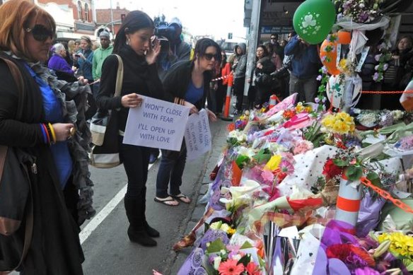 A floral shrine for Jill Meagher in front of the bridal shop where she was last seen alive.