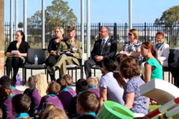 Barry Urban on Anzac Day 2017 wearing the fake medal at a school assembly.