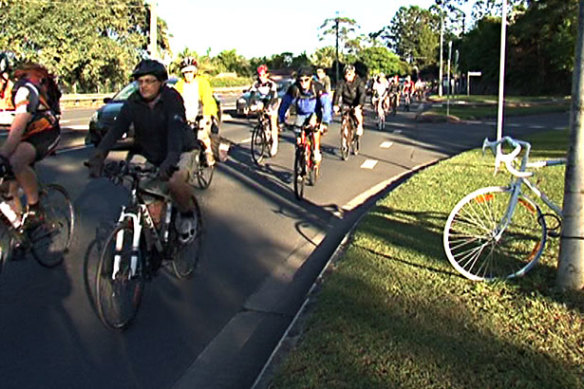 Cyclists ride in 2012 in memory of Richard Pollett, who was crushed by a truck on Moggill Road a year earlier.
