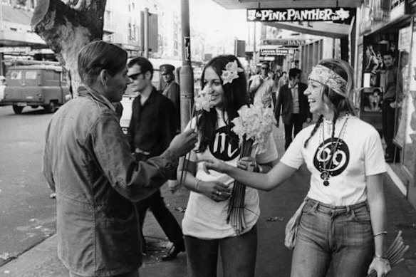 Hippies handing out daffodils to Kings Cross pedestrians in 1969.