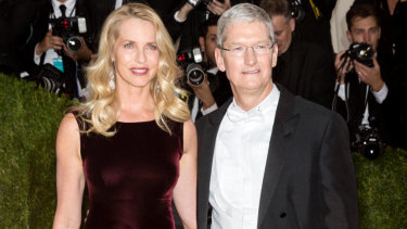 Apple chief Tim Cook with Laurene Powell Jobs. 
