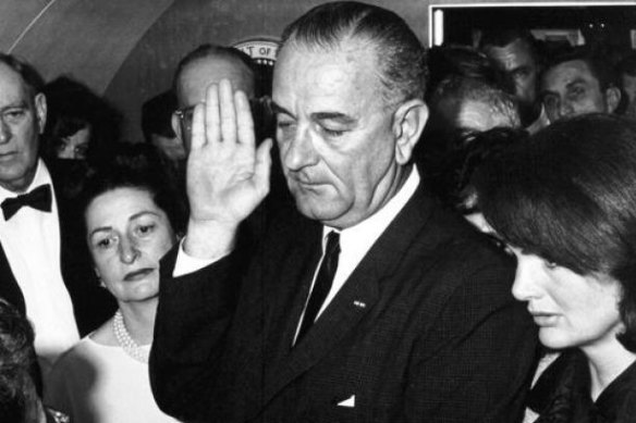 Lyndon B Johnson is sworn-in as 36th President of the United States, as Jackie Kennedy stands beside him, after the assassination of John F Kennedy. 