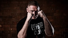 George Burgess poses in preparation for his fight against Nelson Asofa-Solomona.