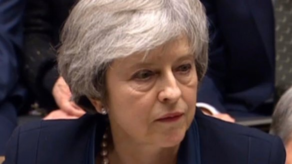Britain's Prime Minister Theresa May speaks after losing a vote on her Brexit deal, in the House of Commons.