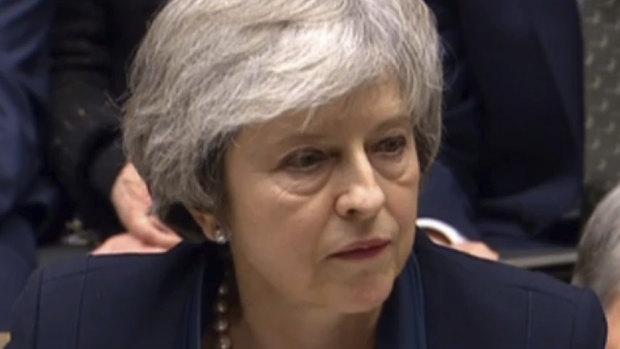 Britain's Prime Minister Theresa May speaks after losing a vote on her Brexit deal, in the House of Commons.
