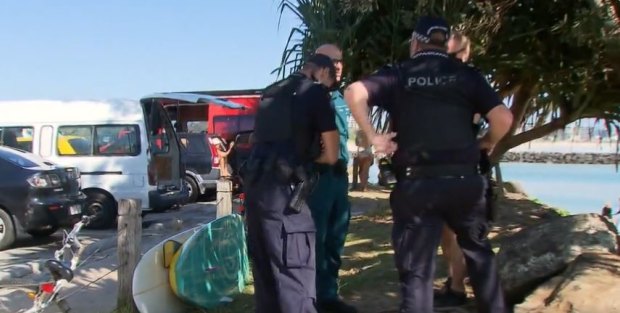 Man dies on Gold Coast beach after being pulled to shore by son