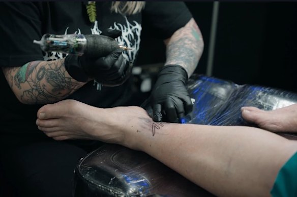 Thomas in the chair getting freshly inked.