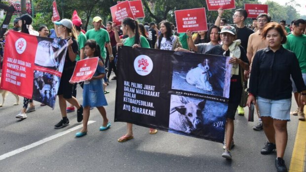 Members of the Dog Meat-Free Indonesia coalition protest against the killing of dogs for meat in their country.